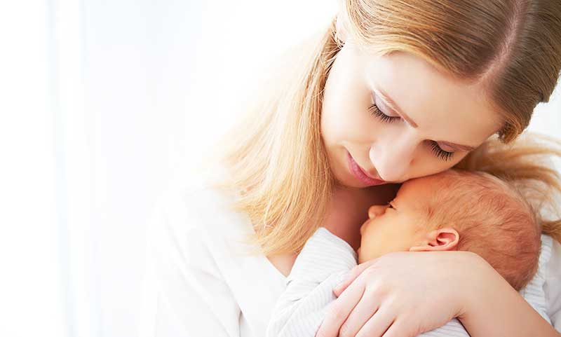 Mother holding infant child